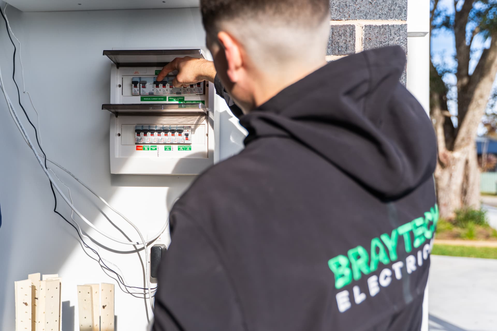 Braytech electrician working on a residential switchboard